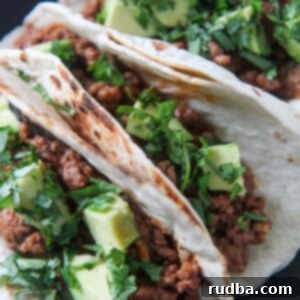 Bayou Beef Tacos 4 three Cajun beef tacos on a black plate
