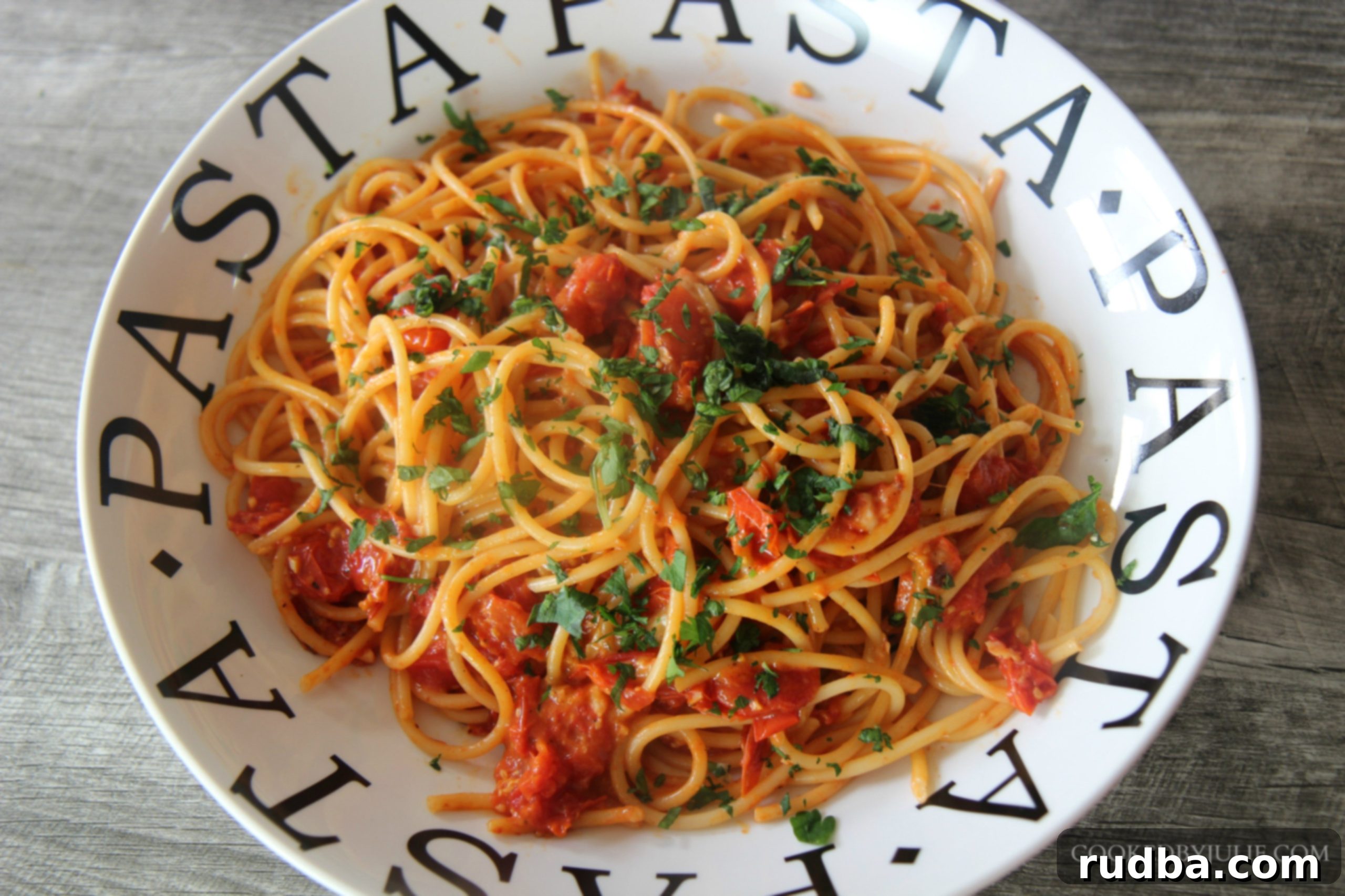 This refreshing roasted tomato bucatini dish is made with fresh roasted tomatoes, tender pasta, and a sprinkle of cheese