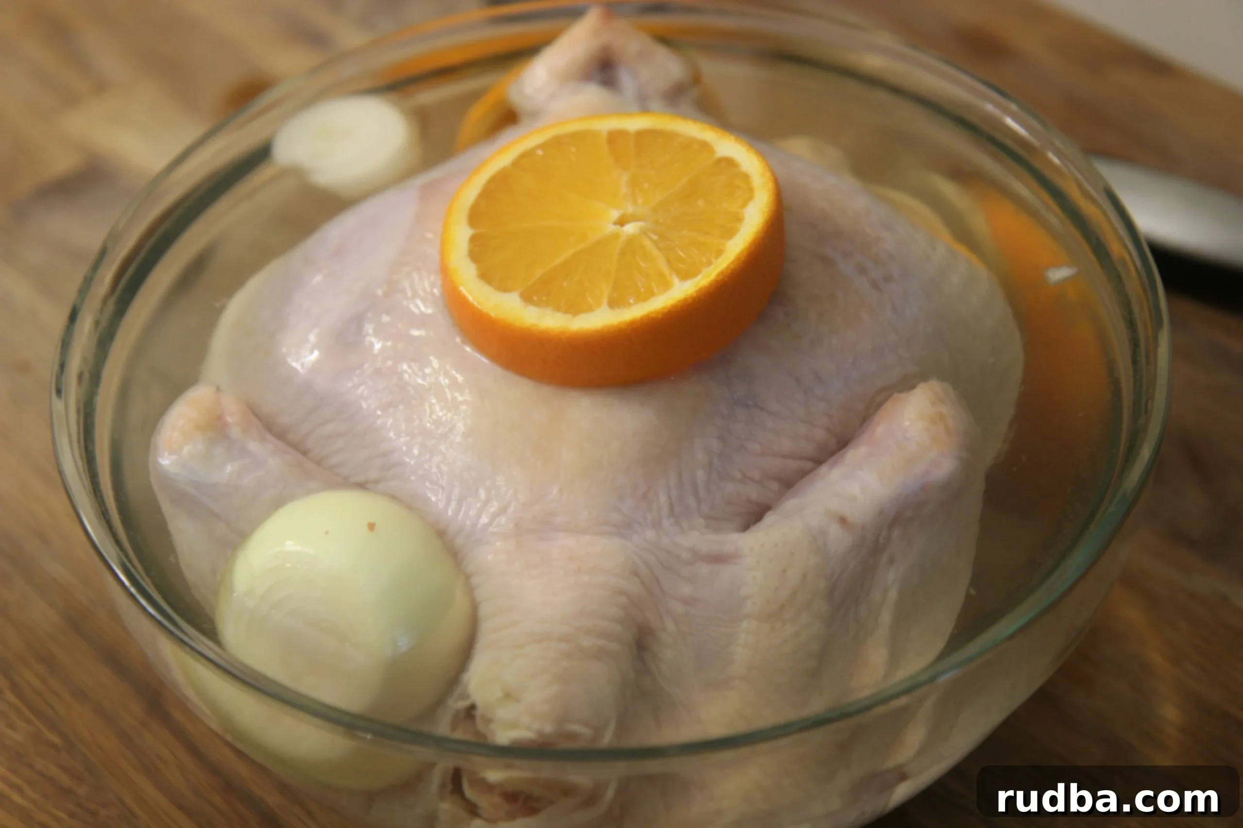 Brine the chicken in a mixture of water, salt and sugar with garlic, onions and oranges