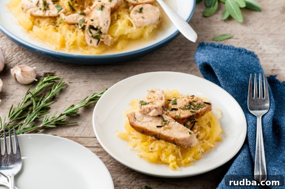 A perfectly portioned serving of spaghetti squash with garlic cajun chicken on a pristine white plate, with a fork resting beside it, ready for a healthy meal.