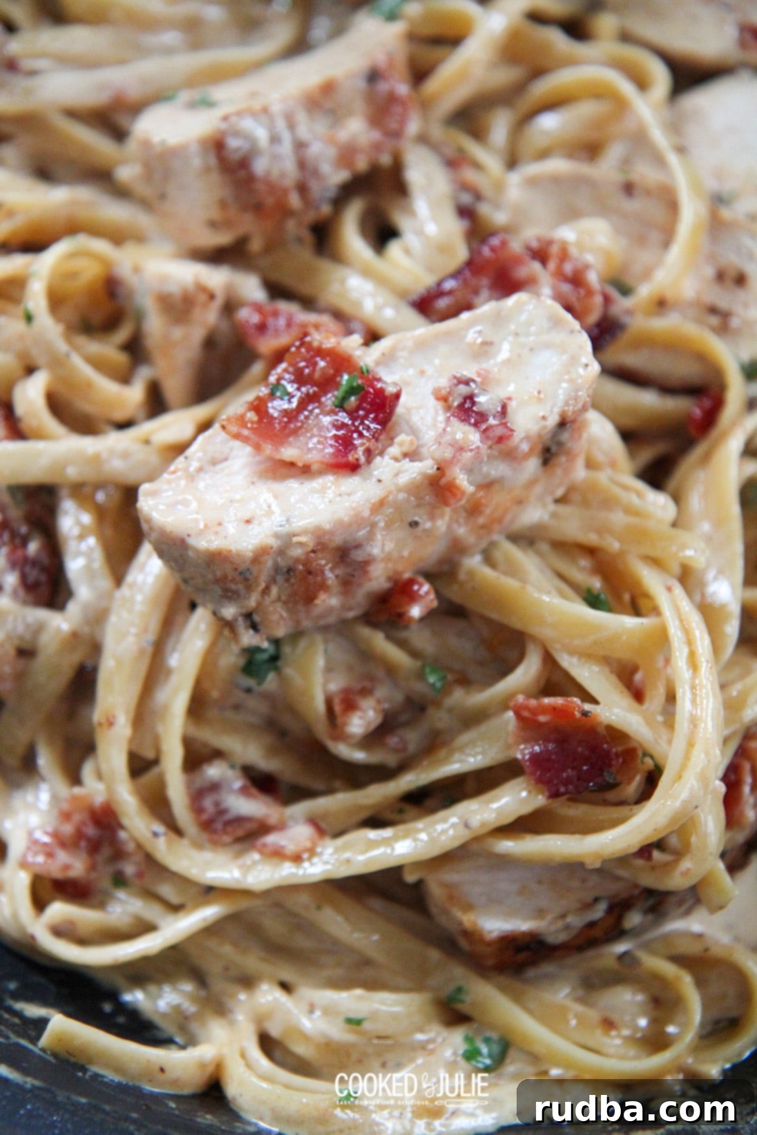 creamy chicken and bacon pasta up close, showcasing the rich sauce and ingredients