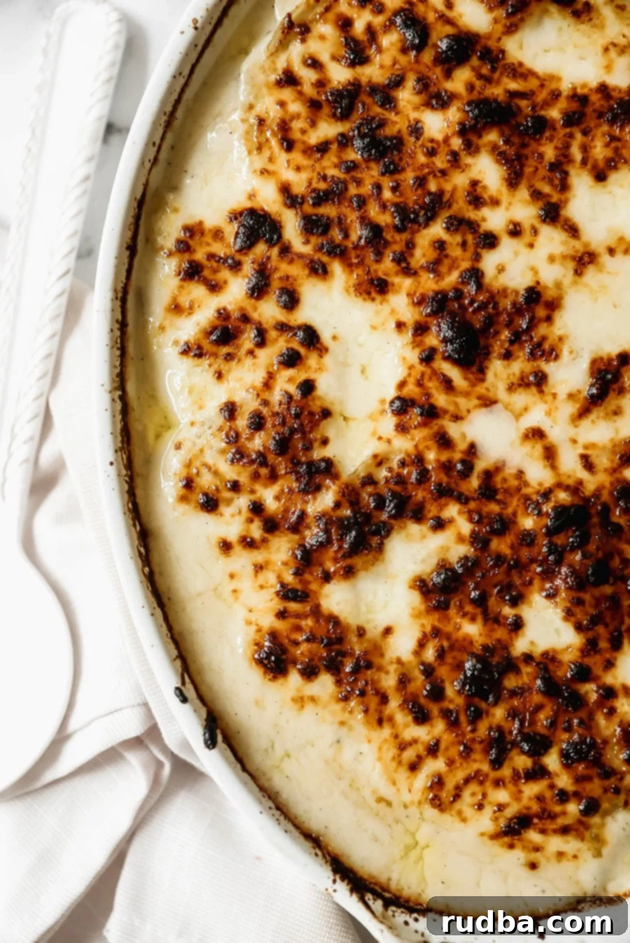 Creamy Cheesy Scalloped Potatoes 4 cheesy scalloped potatoes up close.