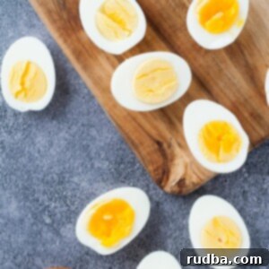 scattered boiled egg halves with a pinch bowl of salt and pepper