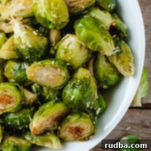 baked brussel spouts in a white bowl