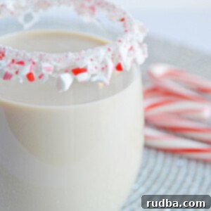 Minty White Russian 5 peppermint white Russian in a glass with a candy cane rim