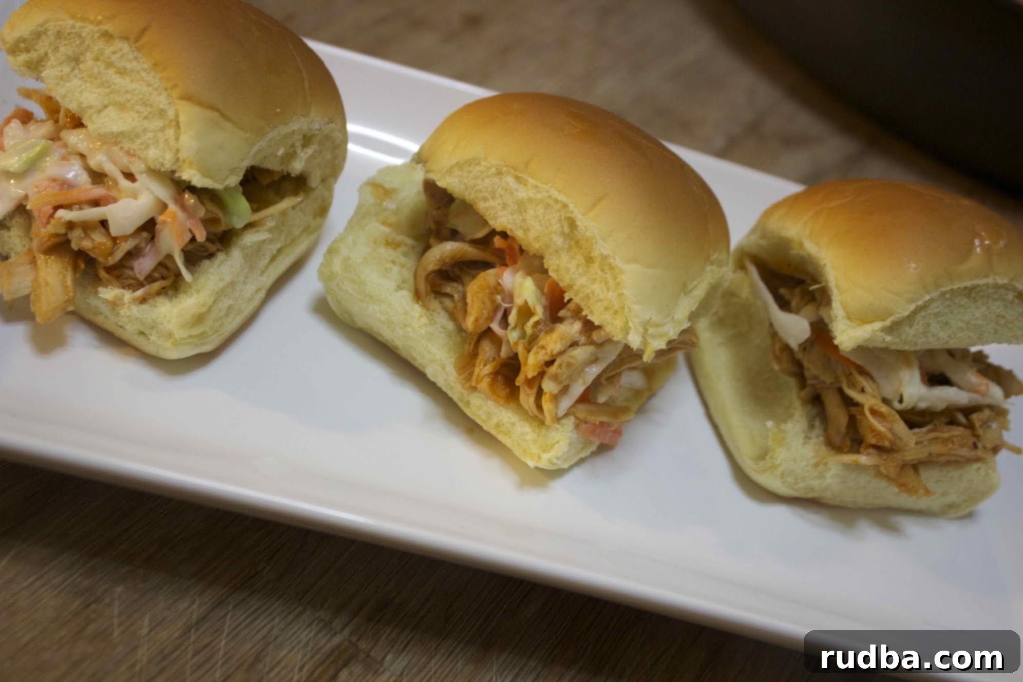 These BBQ pulled chicken sliders are made with a delicious homemade BBQ sauce that's super easy to make with common ingredients