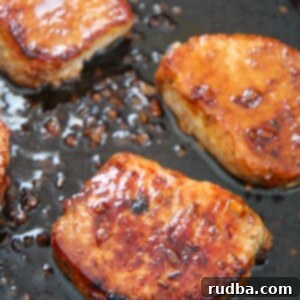 Sticky Honey Garlic Pork Chops 4 three honey garlic pork chops in a black skillet