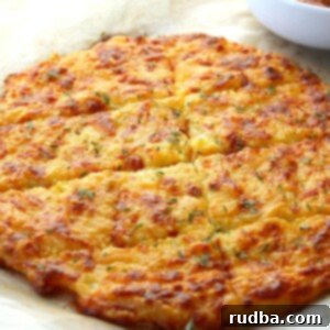 Cheesy Keto Bread 6 keto cheese bread on parchment paper with sauce