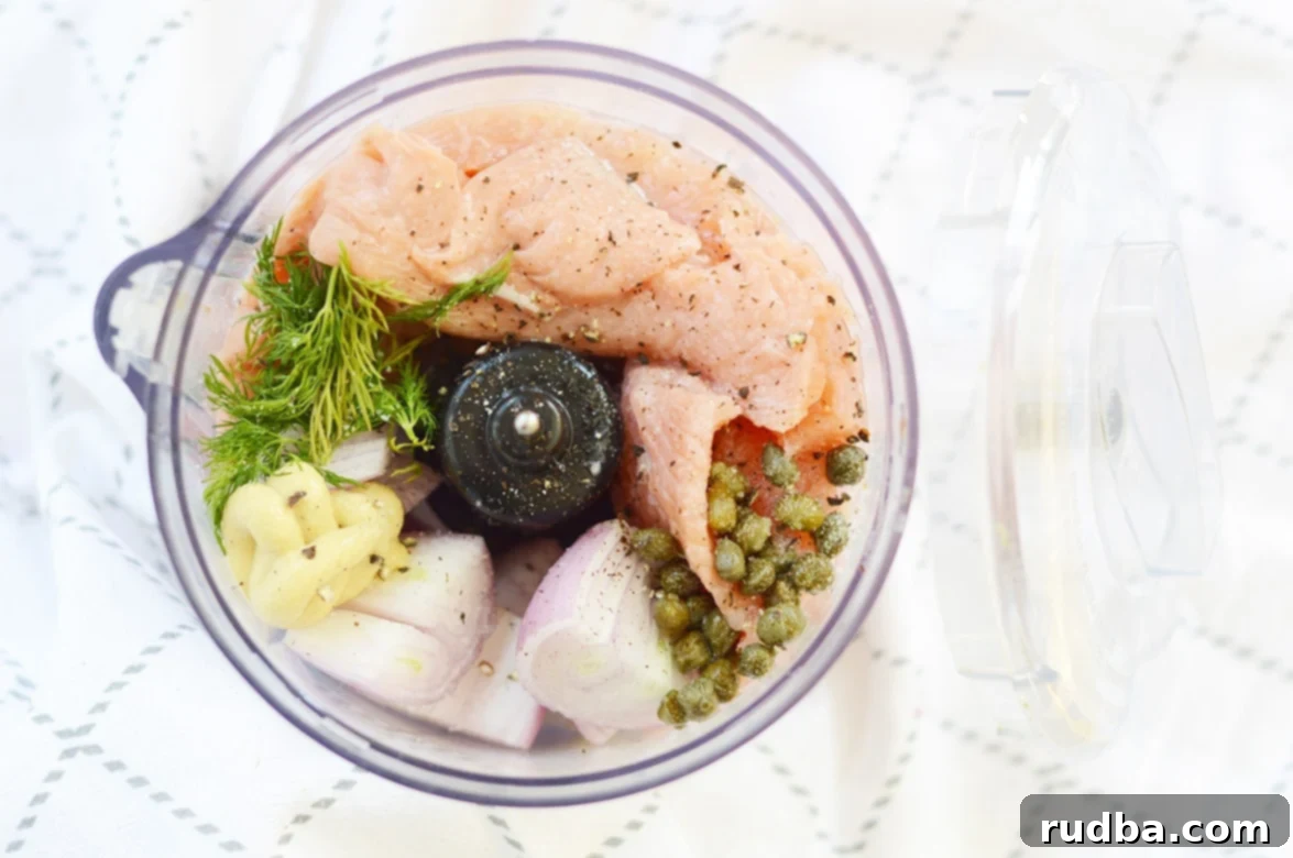 Ingredients for salmon burgers in a food processor