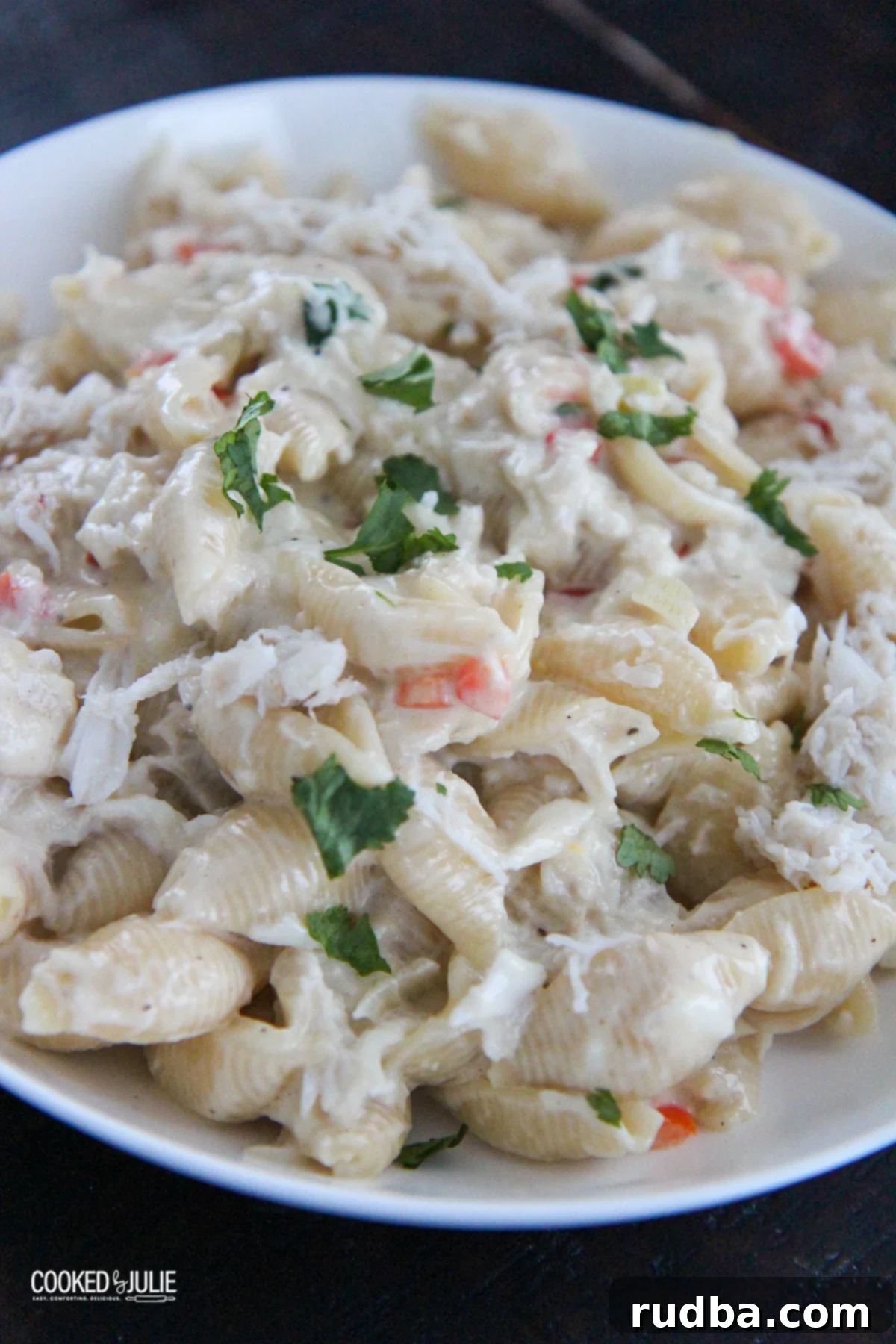 cheesy crab Alfredo pasta in a white bowl