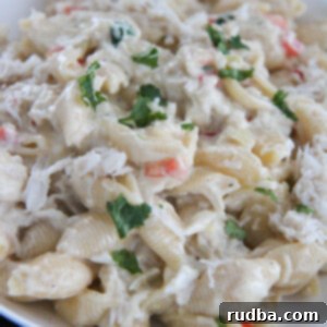 cheesy crab Alfredo pasta in a white bowl