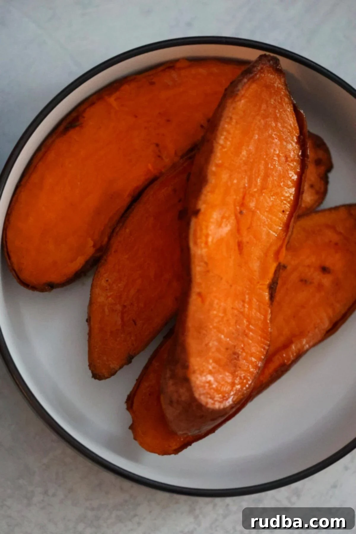 Roasted Spatchcock Chicken and Root Vegetables 5 cooked sweet potatoes up close.