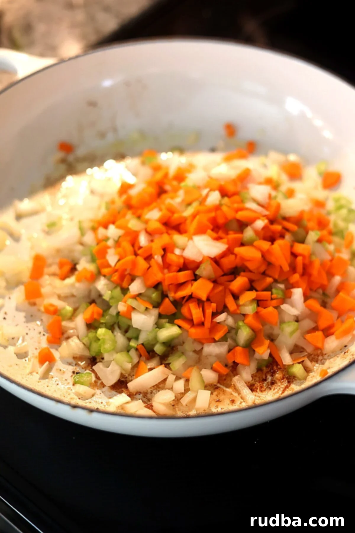 Veggies cooking in a dutch oven.