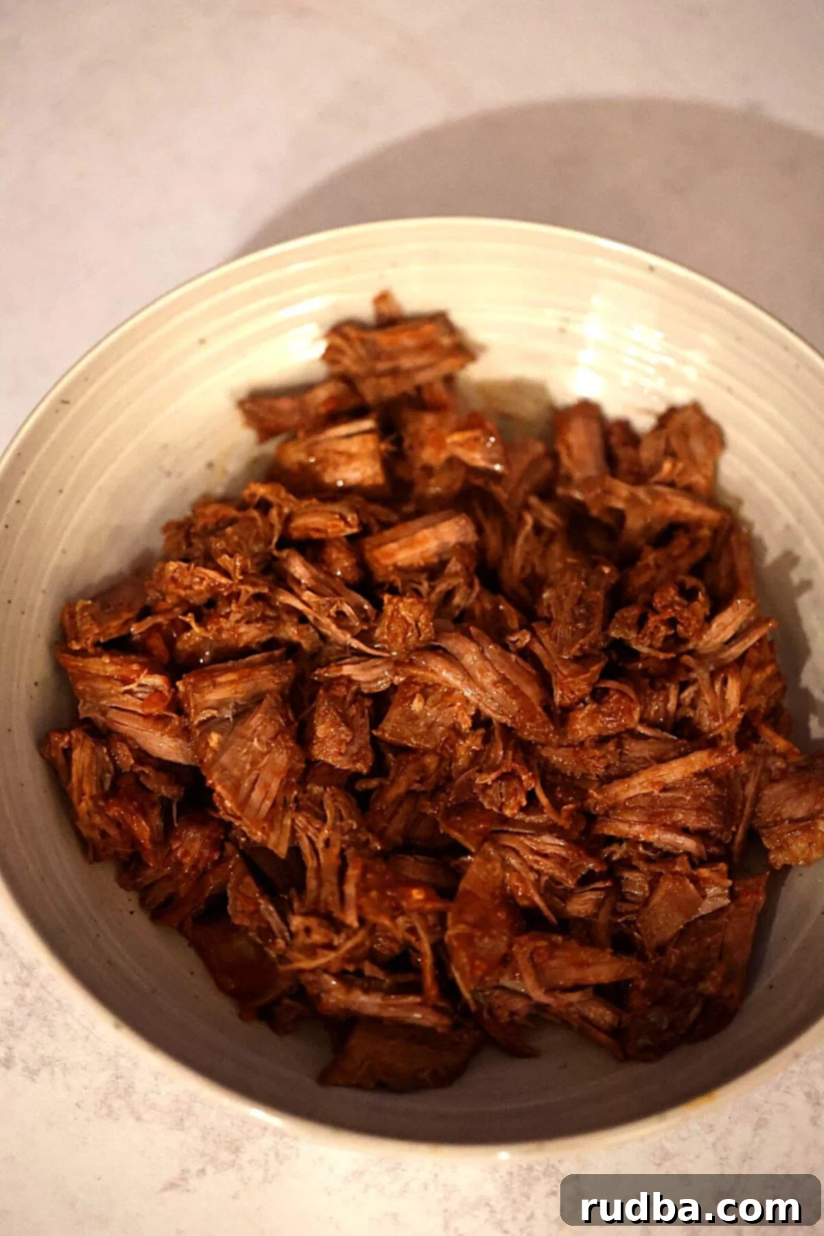 Shredded beef in a bowl.